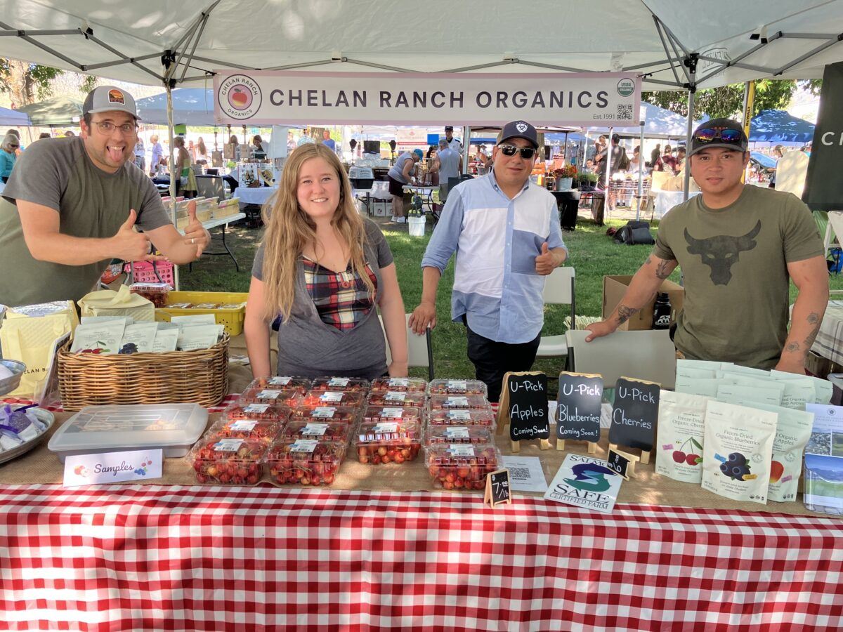 Farmer's Market Crew selling harvest cherries