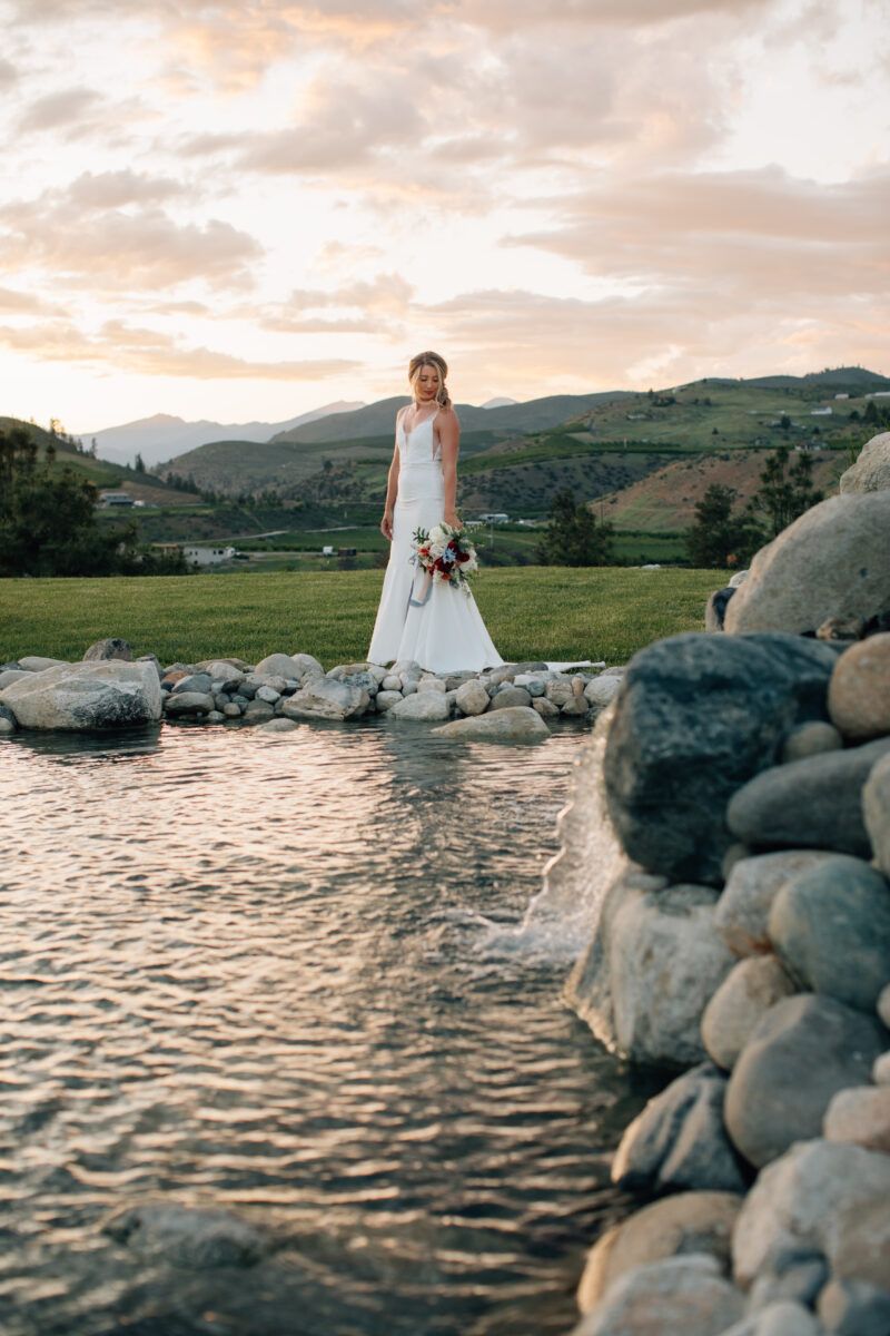 The Venue at Chelan Ranch Golden hour bride by waterfall