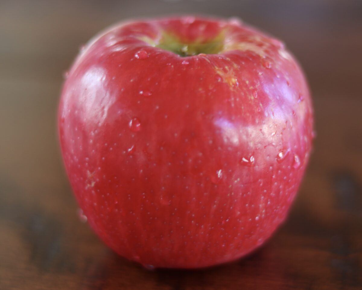 Honeycrisp apple on table for fiber that will help you lose weight