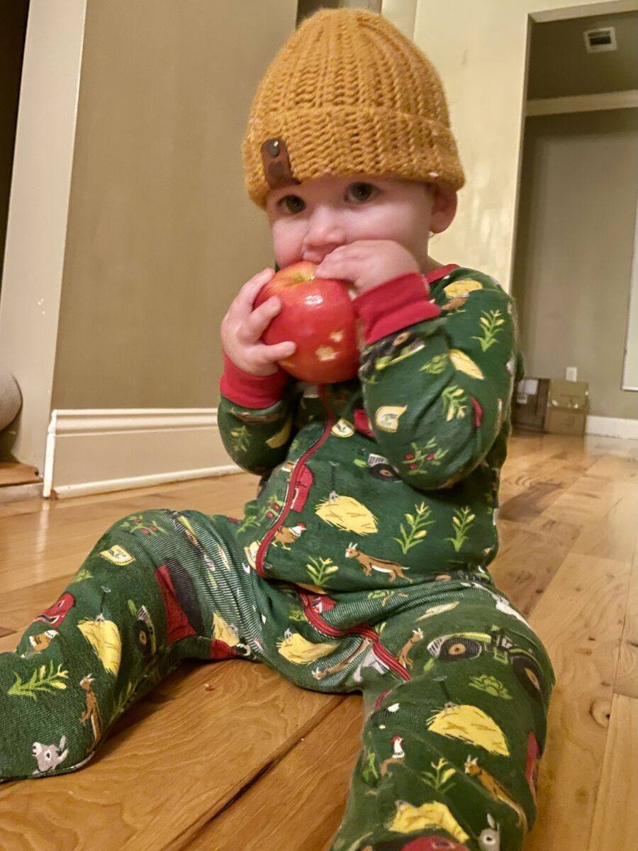 baby with apple for teething